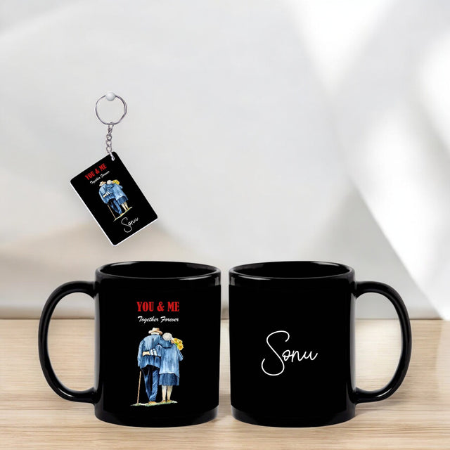 Anniversary Combo – Black Mug & Keychain with You and Me Quote and Old Couple Design with Name Printed.